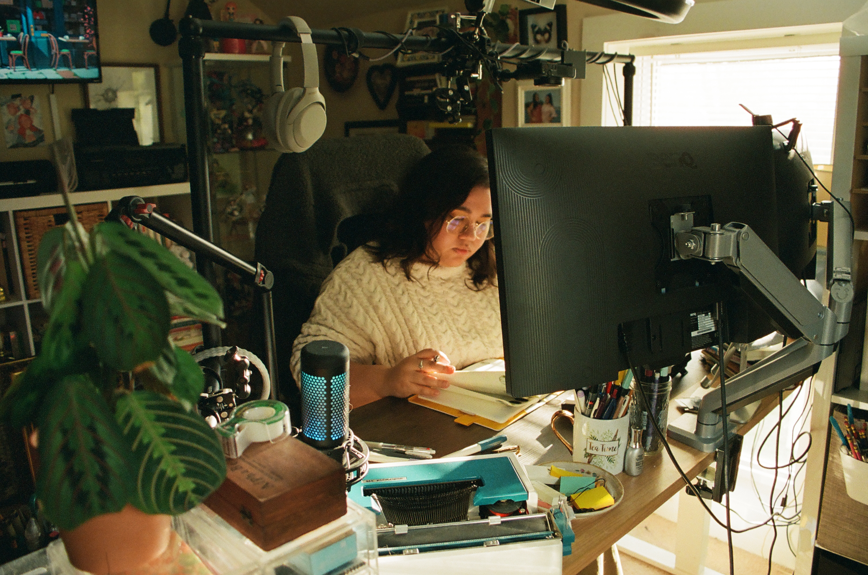 the founder of Wider View Studios, Chris, sitting at their desk working